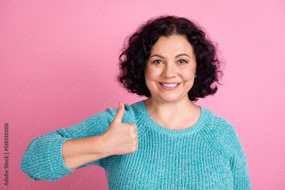 Photo portrait of senior woman showing thumb-up gesture smiling isolated pastel color background Photo portrait of senior woman showing thumb-up gesture smiling isolated pastel color background