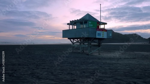 Aerial: Bethells beach lifeguard patrol tower, New Zealand photo