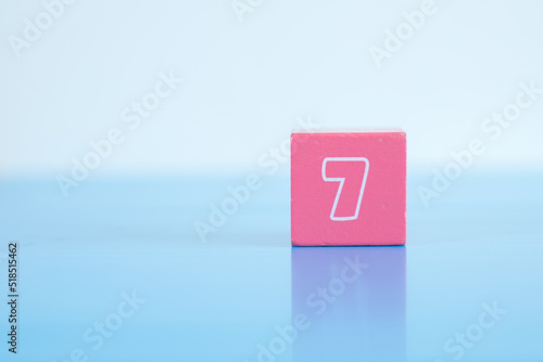 number seven inscription on the cubes of pink © Sam