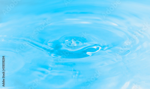 water drop, bubbles and water ripples on pale blue light effects background. 