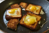 Cooking croutons with an egg inside