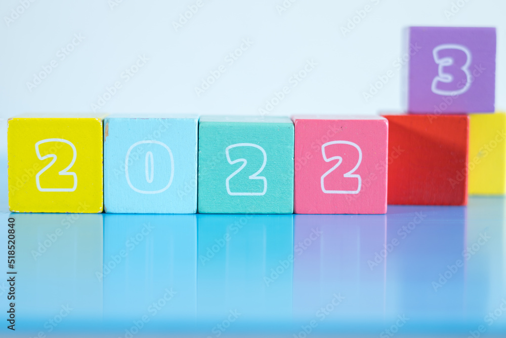 New Year Concept. Wooden blocks bearing numbers of 2022, 2023 and 2024 isolated on white background. 