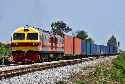 Container-freight train by diesel locomotive on the railway in Thailand