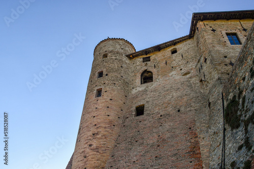 Low-angle view of the medieval castle, characterized by three cylindrical towers, in the Langhe vineyard area, Unesco Site, Castiglione Falletto, Cuneo, Piedmont, Italy © Simona Sirio
