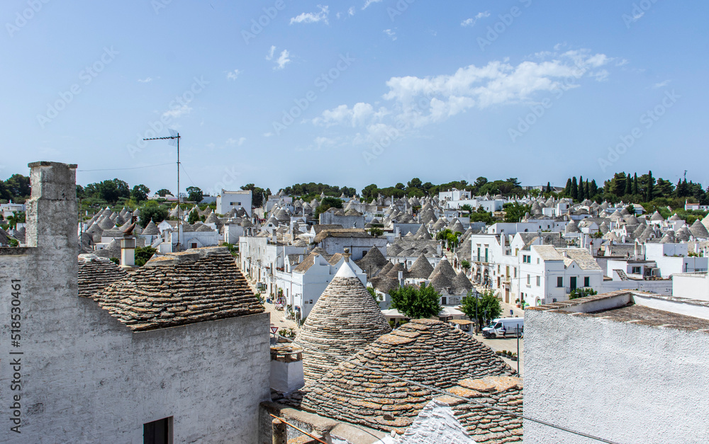 Obraz premium The trulli, typical limestone houses of Alberobello in southern Puglia, Italy, are extraordinary examples of dry stone slab construction, a technique dating back to prehistoric times and still used