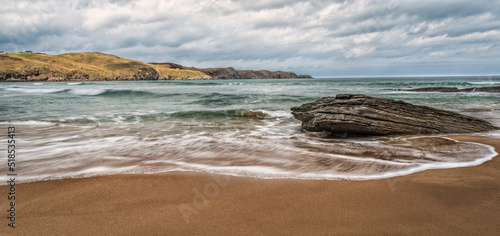 Waves on the beach at Strathy Bay on the north coast of Scotland photo