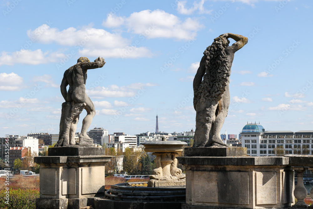 rear view of two statues from park the saint-cloud viewpoint in Paris