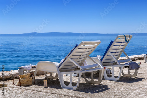 Deck chair on the beach © borisb17