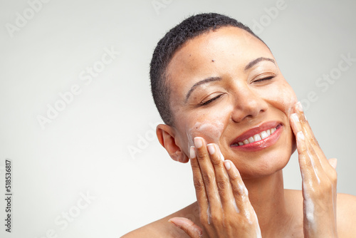 Portrait�of smiling woman washing face