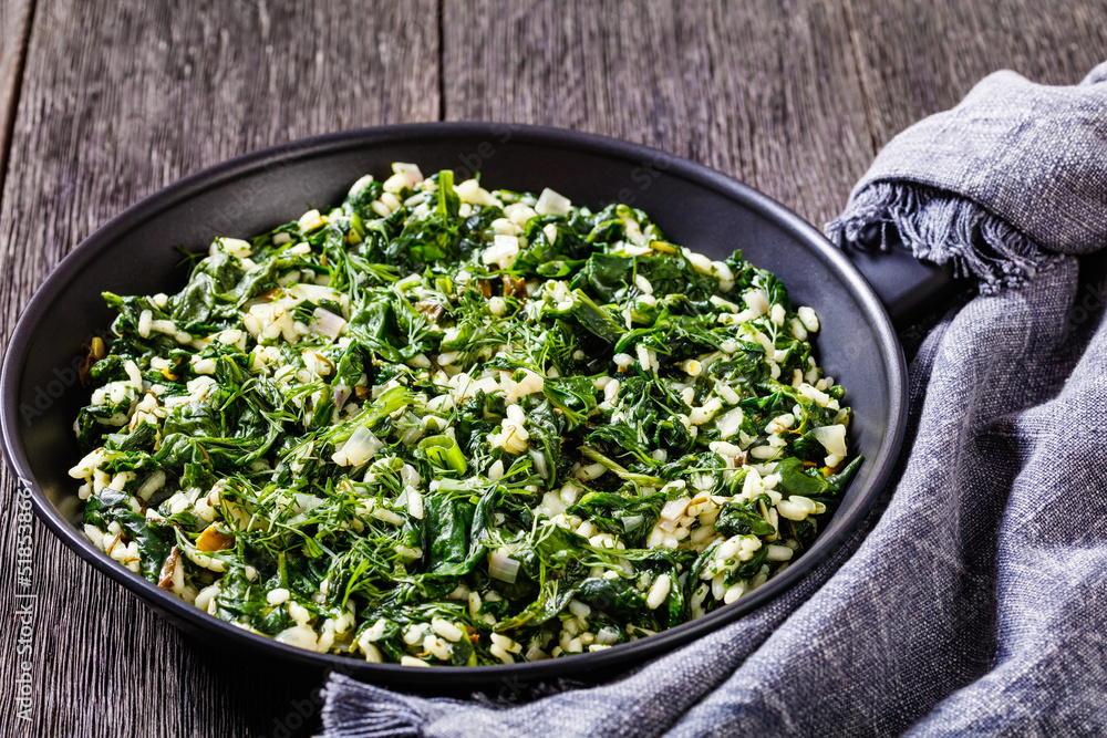 Spanakorizo, Greek spinach and rice pilaf in pan Spanakorizo, Greek spinach and rice pilaf in pan