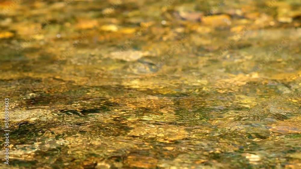 Fresh water flowing through a mountain river with sound Fresh water flowing through a mountain river with sound