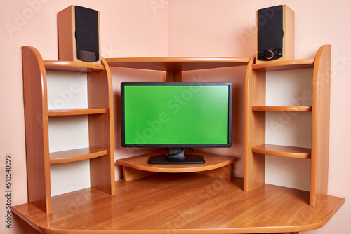 Background in the form of a computer desk with a monitor and sound speakers.