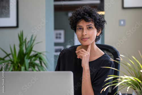 Portrait of young woman in office photo