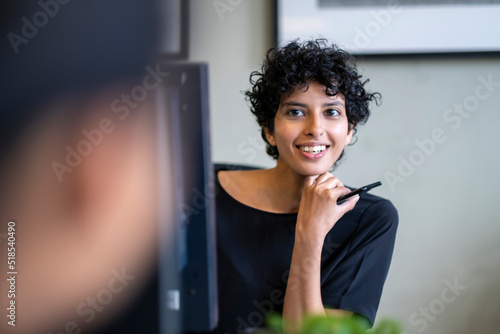 Young smiling woman in office photo