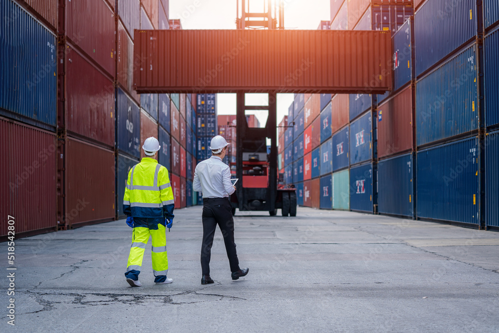 Industrial engineer and inspector or safety supervisor working in container terminal,Container in export and import business and logistics. Industrial engineer and inspector or safety supervisor working in container terminal,Container in export and import business and logistics.