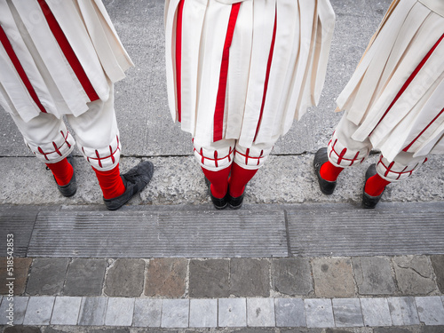 Feet and red socks of some participants in costume during the traditional Ommegang ceremony in front of the Church of Lady of the Sablon in Brussels, Belgium. photo