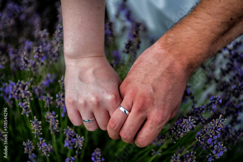 bride and groom holding hands