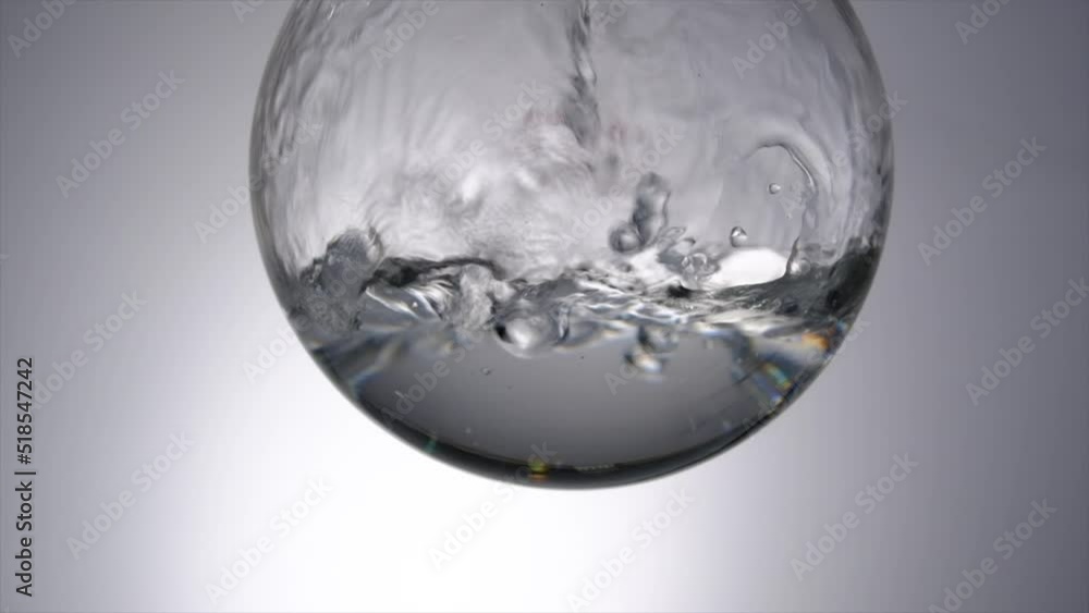 Fluid flow into circle beaker with for science advertising laboratory background , research science content Fluid flow into circle beaker with for science advertising laboratory background , research science content