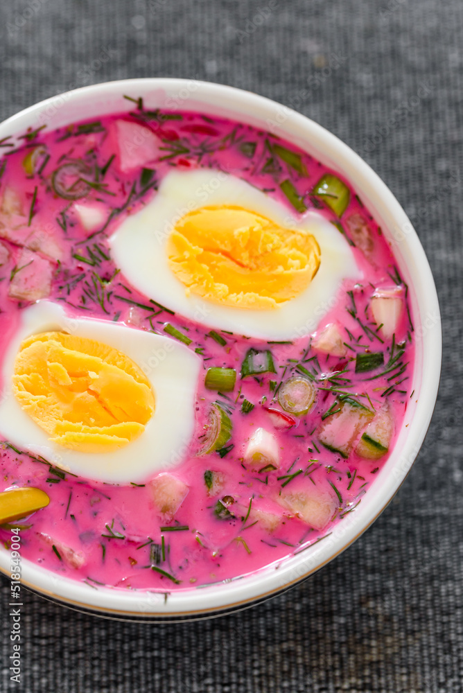 Cold beetroot soup with eggs and fresh vegetables. Popular Polish and Ukrainian meal during summer