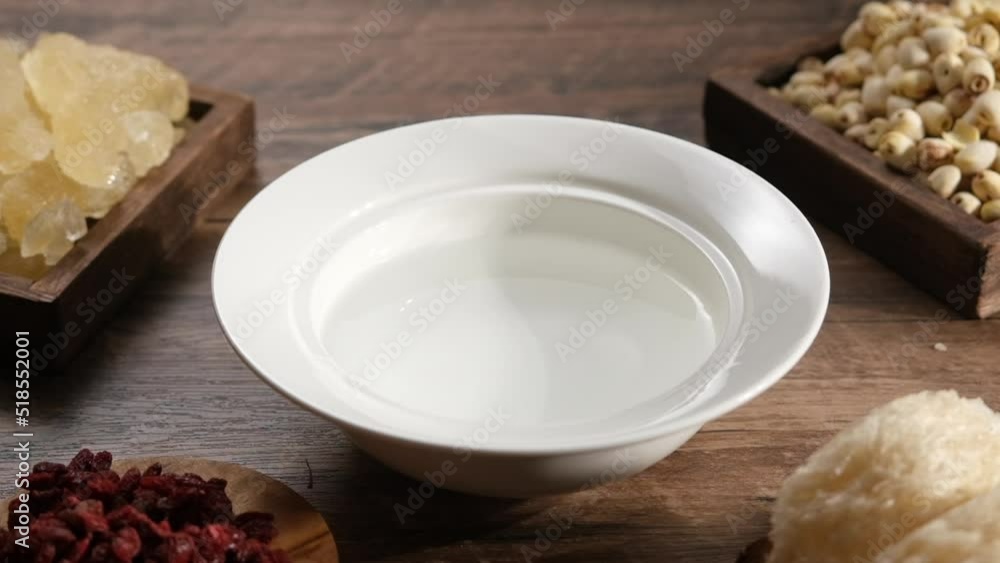 Cooking birdnest in wooden table with ingredient , expensive and healthy content , video clip stock Cooking birdnest in wooden table with ingredient , expensive and healthy content , video clip stock