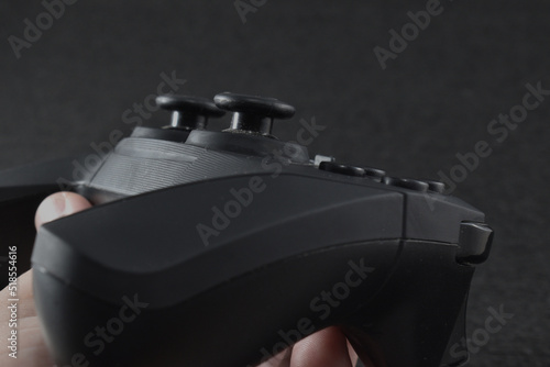 a black console controller with a black background