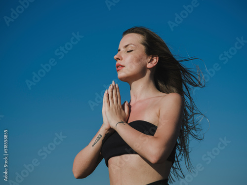 beautiful woman doing yoga in nature