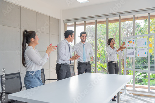 business woman presentation plan marketing or project in future in meeting room and  team applauded