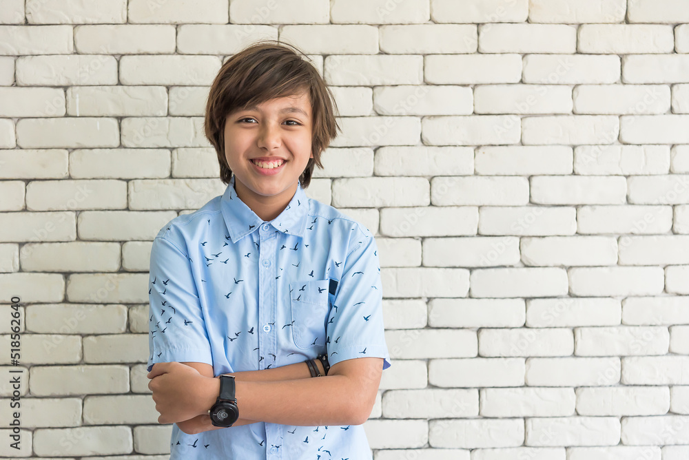 secondary chool boy student standing in front of classroom smiling and looking at camera secondary chool boy student standing in front of classroom smiling and looking at camera