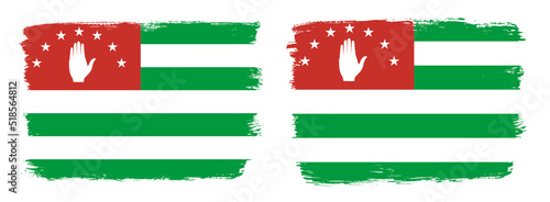 A set of two vector brush flags of Abkhazia with abstract shape brush stroke effect