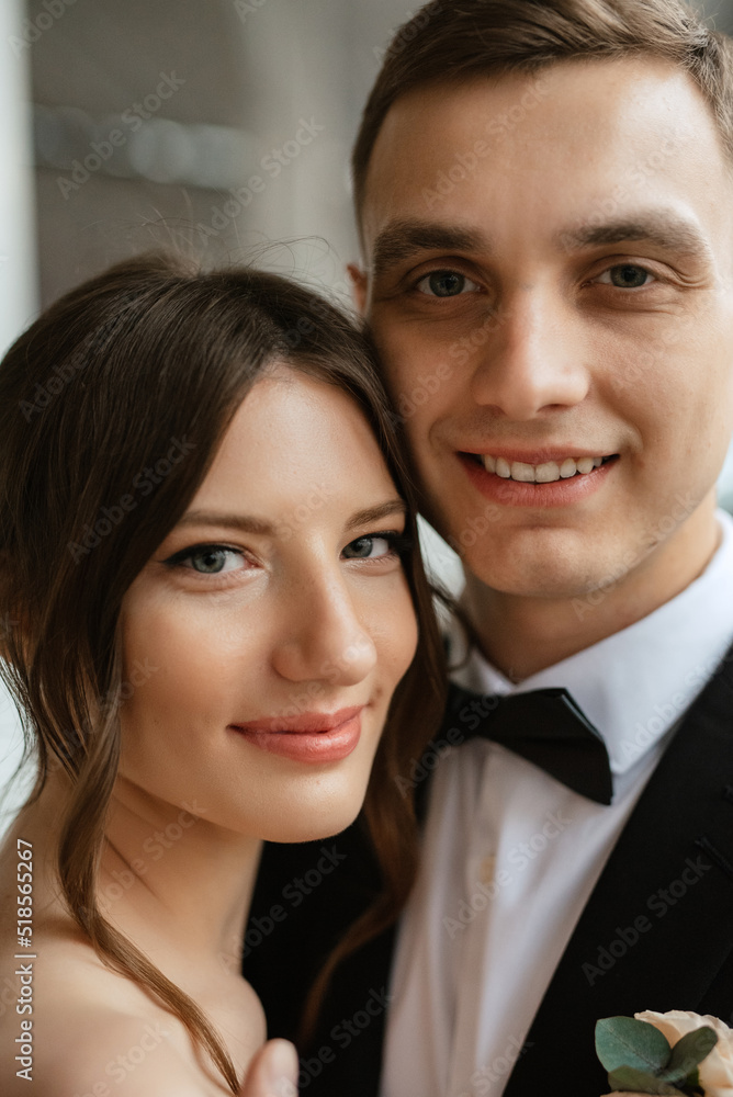 young couple bride and groom in a white short dress