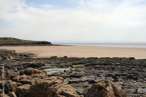 Rocks at Rest Bay Porthcawl Wales UK, Welsh Coastline, Coast, British coastline. Quiet empty beach photo