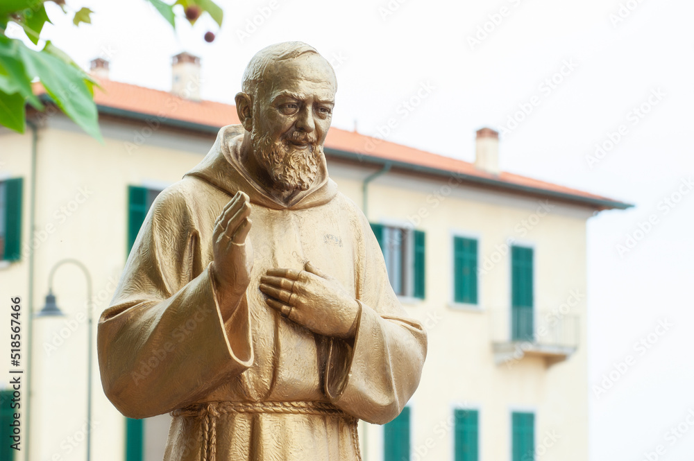 Piombino, Livorno, Italy - 2022, May 27: Padre Pio (Father Pio) golden  statue, in the act of blessing. Copy space. Stock Photo | Adobe Stock