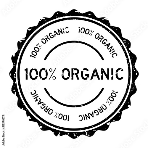 Grunge black 100 percent organic word round rubber seal stamp on white background