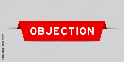 Red color inserted label with word objection on gray background