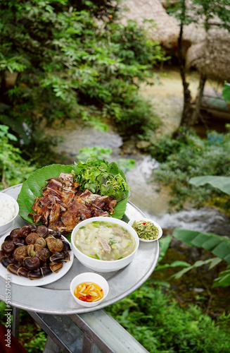 Local family cooked meal served by a restaurant near famous waterfall in Pu Luong, Vietnam                               