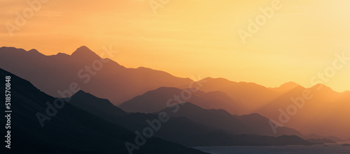 epic sunset above mountain layers in the alps