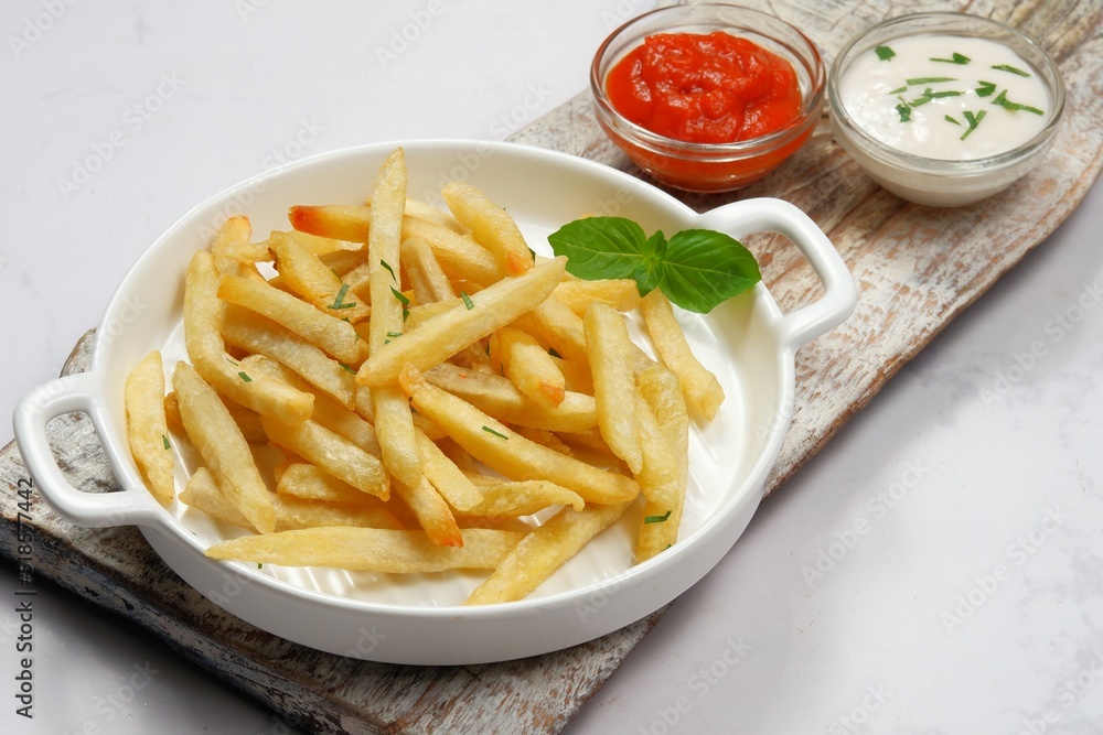 French fries with Mayonnaise and chili sauce on white background French fries with Mayonnaise and chili sauce on white background