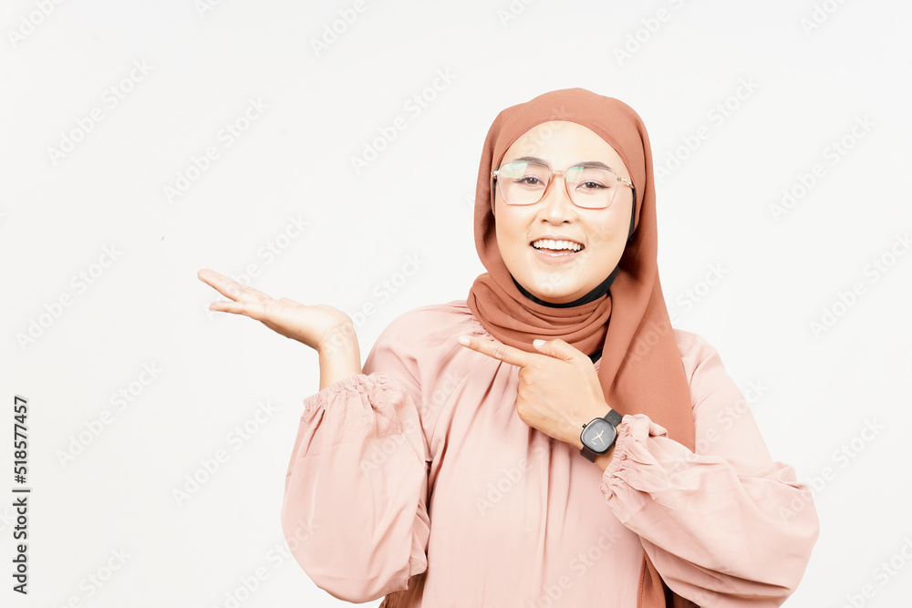 Showing and Presenting Product on Open Palm of Beautiful Asian Woman Wearing Hijab Showing and Presenting Product on Open Palm of Beautiful Asian Woman Wearing Hijab