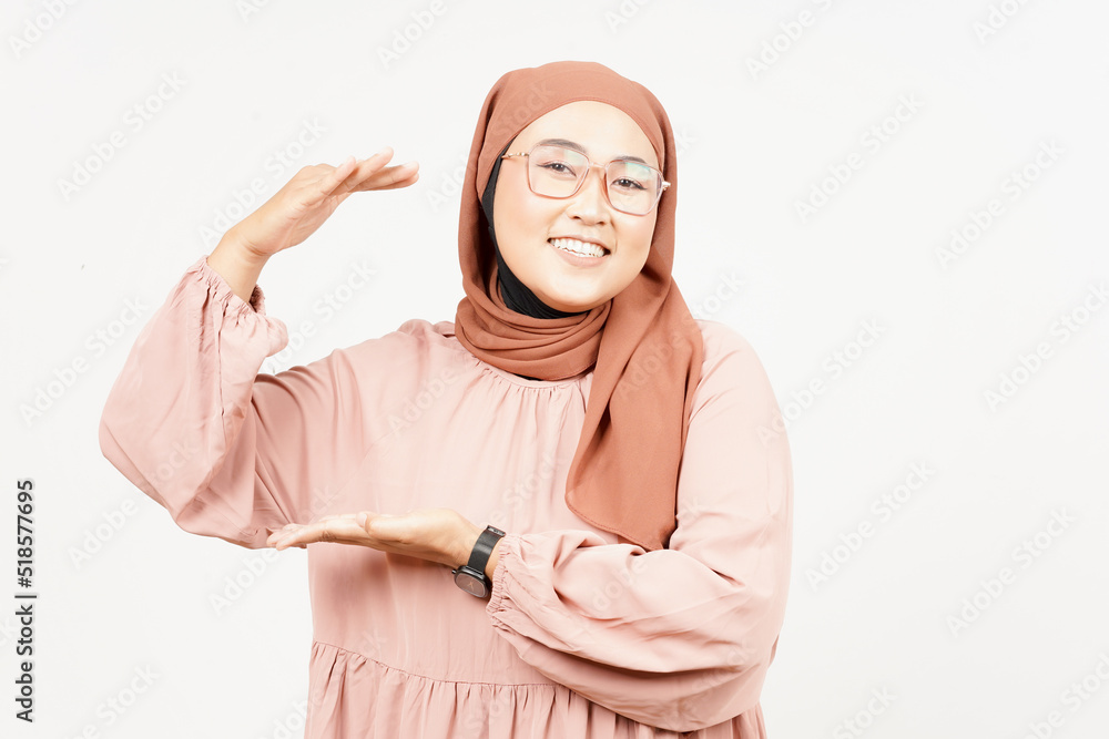 Measuring and Showing Big Sign Product of Beautiful Asian Woman Wearing Hijab Isolated On White Measuring and Showing Big Sign Product of Beautiful Asian Woman Wearing Hijab Isolated On White