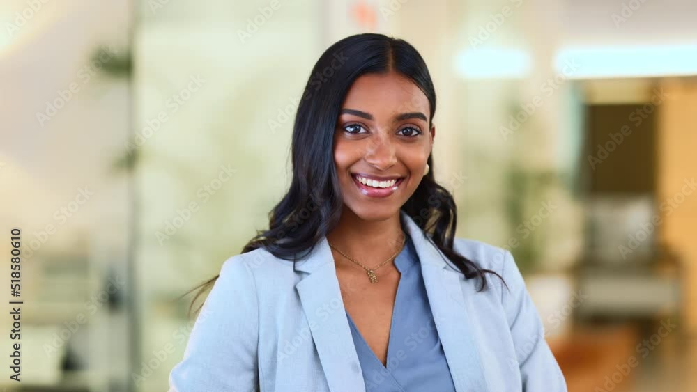 Successful female executive typing or reading an email. Confident business woman using a computer at work. A beautiful corporate receptionist sitting in an office chair, smiling. Successful female executive typing or reading an email. Confident business woman using a computer at work. A beautiful corporate receptionist sitting in an office chair, smiling.
