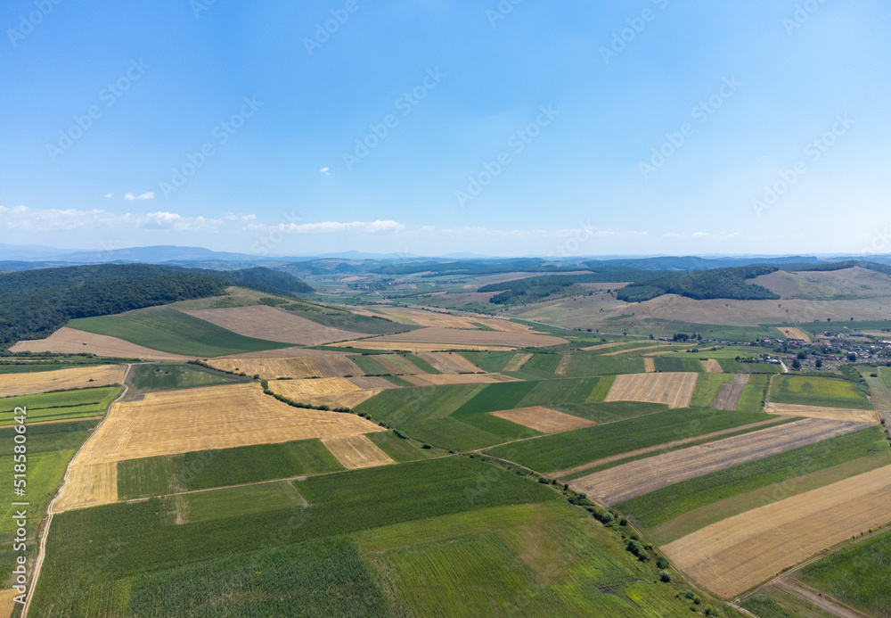 an aerial view of a field with many agricultural crops
