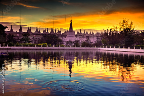 Reflection of pagodas on the lake in colorful sunrise in the morning at Myanmar. © sippakorn
