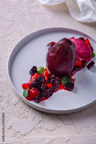 Fruit sorbet with boiled pear, marmalade, strawberries, nasturtia leaves, blackberries and jam photo