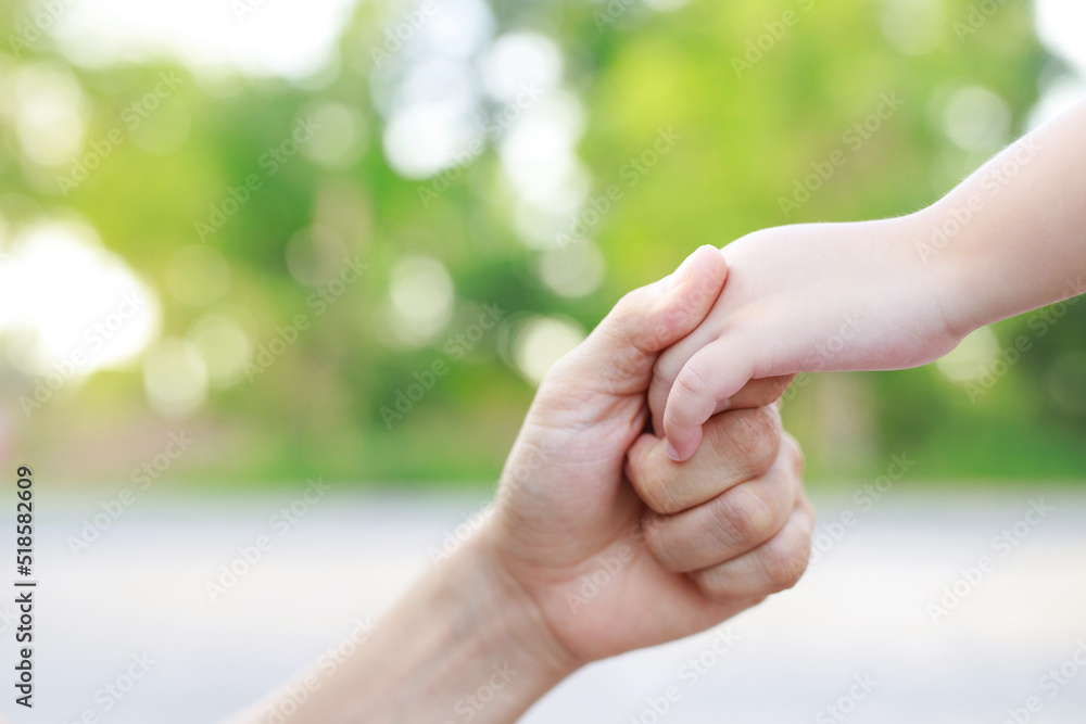 Children's hands with the warmth of mother's care Children's hands with the warmth of mother's care