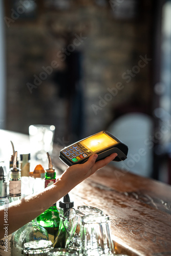 paying with smartphone at a bar