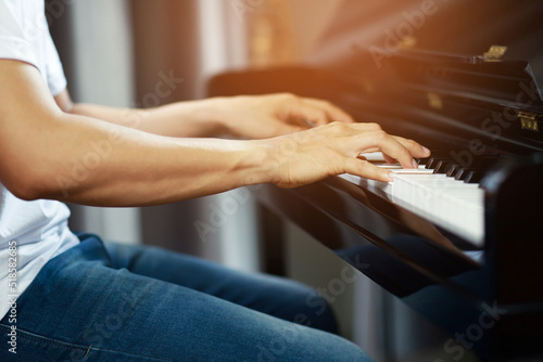 Fotografija close up of hand people man musician playing piano keyboard with selective focus keys