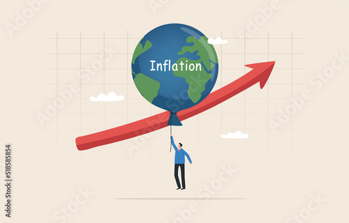 High global inflation. FED interest rate hike. .floating interest. Global economic crisis. economic slow down, inflation high up. Balloon with the symbol of the world map floats higher.