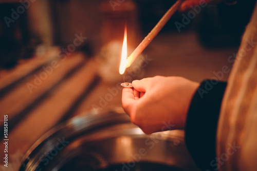 burning cigarette in hand