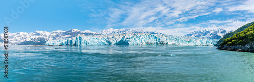 A panorama view of the end of the Hubbard Glacier in Disenchartment Bay, Alaska in summertime