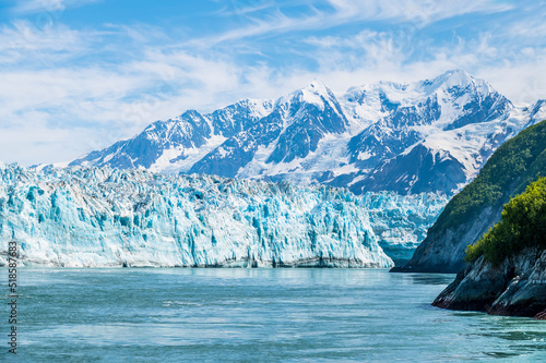 A view of the end of the Hubbard Glacier from  Disenchartment Bay stretching into Russell Fjord, Alaska in summertime photo